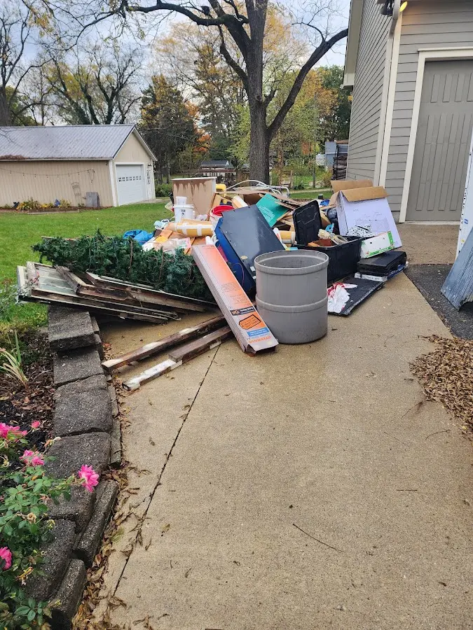 Dumpster being loaded with debris for 30 Yard Dumpster Rental in Hillsborough